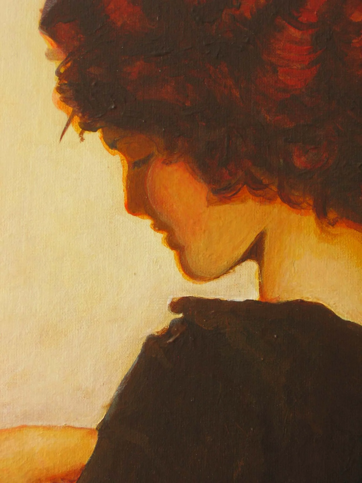 Painted amber-toned profile of a figure with curly hair