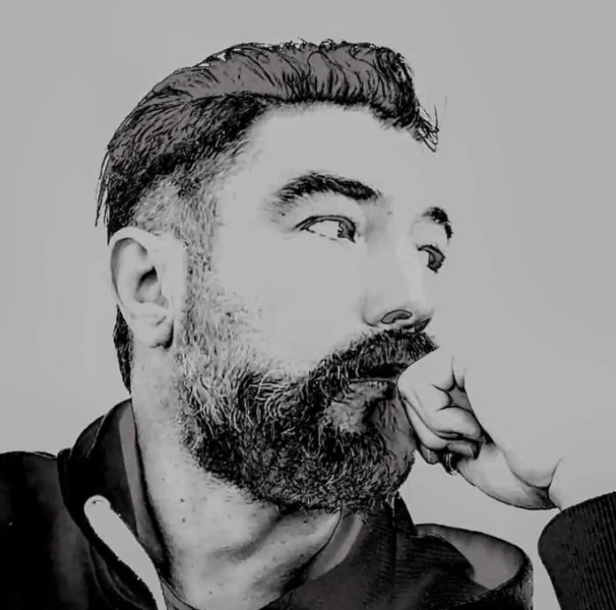 Black and white portrait of the painter Christian, looking to the side with his hand at his chin